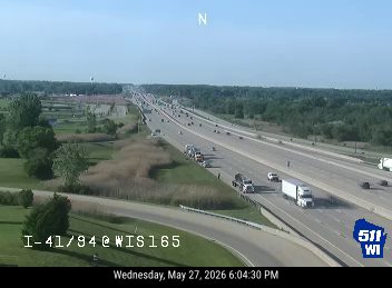Multiple vehicles stopped on the highway, appearing to be a multi-vehicle crash.
