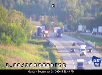 Tow truck with amber lights on the right shoulder