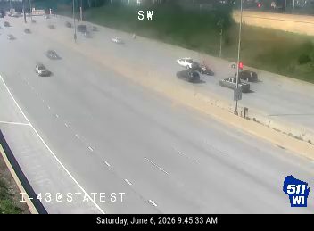 Two vehicles appear to be involved in a crash on the highway.