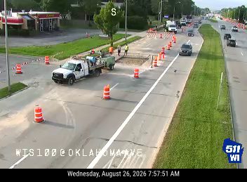 Construction cones and workers in the right lane