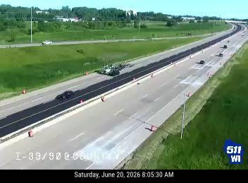 Construction equipment and workers in the right lane