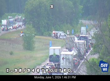 Emergency vehicles and traffic stopped on I-90/94 due to an incident.