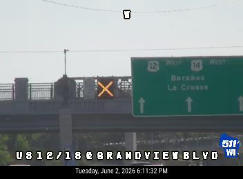 Flashing yellow X signal indicates a potential hazard or closure ahead.