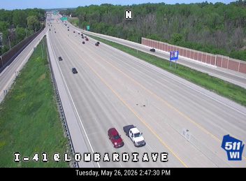 Two vehicles stopped in the roadway, one appears to be a crash.