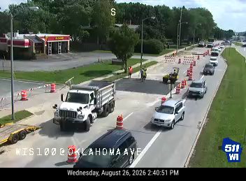 Construction cones and workers in the right lane