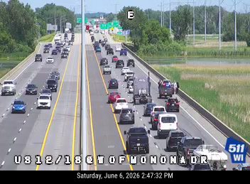 Vehicle overturned on the right shoulder of the highway.