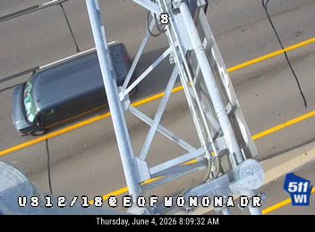 Vehicle is overturned on its side in the roadway.