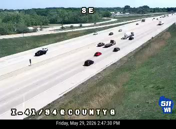 Two vehicles appear to be involved in a crash on the highway.