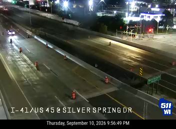 Construction cones and barrels in the left lanes