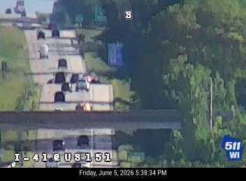 Vehicle appears to be stopped in the roadway, possibly after a crash.