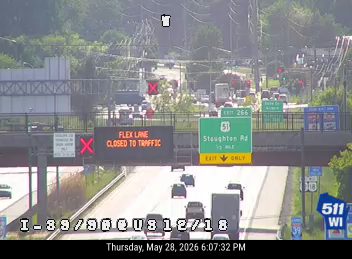 Emergency responders on highway with closed traffic advisory.