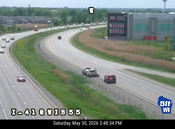 Two vehicles appear to be involved in a crash on the right shoulder.