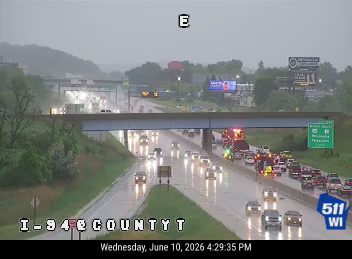 Emergency responders and vehicles on the highway due to an incident.