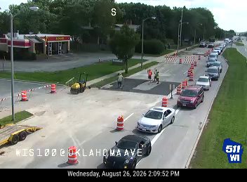 Construction cones and workers in the roadway