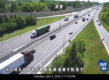 A multi-vehicle crash is blocking the left lanes of the highway.
