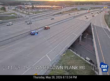 Police and fire vehicles on the highway, likely responding to an incident.