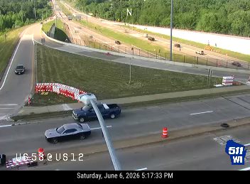 Two vehicles appear to be involved in a crash on the side of the road.