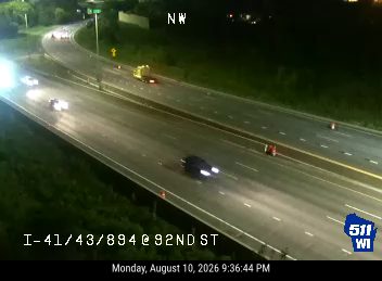 Construction cones and a maintenance vehicle in the right lane