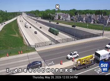 Road work with cones and a truck on the shoulder of I-43 at 8000 Hope Rd.