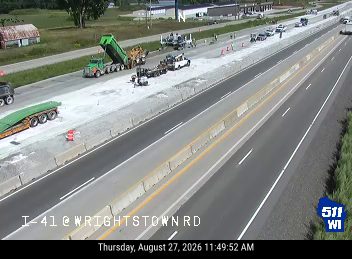 Construction cones and workers in the right lane