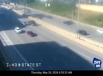 Two vehicles appear to be involved in a crash on the highway.