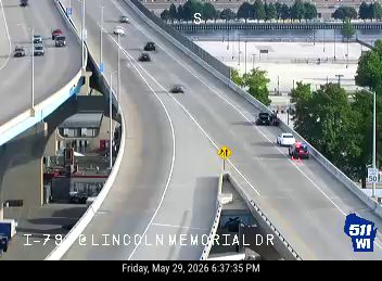 Emergency vehicle on the highway, possibly responding to an incident.