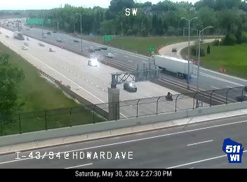 Two vehicles appear to be involved in a crash on the highway.