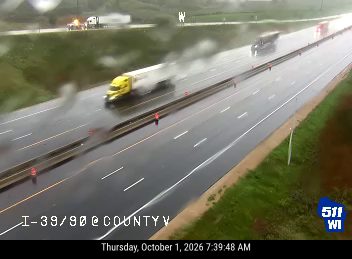 Yellow truck on fire in the right lane