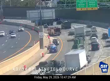 Multiple vehicles involved in a rollover crash on the highway.