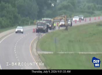 Construction cones and workers in the right lane