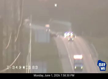 Emergency vehicles with flashing lights on I-94 at WIS 89.