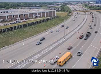 Two vehicles appear to be involved in a crash on the highway.