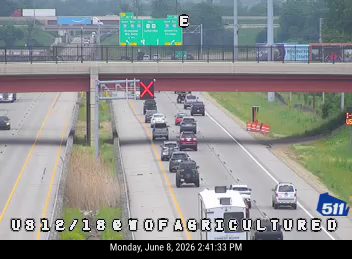 Multiple vehicles stopped in traffic, one appears to be involved in a crash.