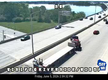 A semi-truck appears to have crashed, blocking a lane of traffic.