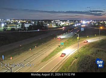 Construction cones and workers in the right lane