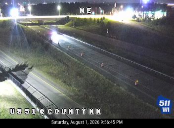 Construction cones and a worker in the right lane