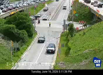 Person directing traffic in the middle of the roadway