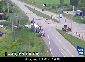 Tow truck and trailer blocking the right lane
