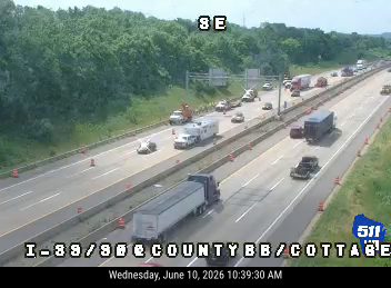 Emergency responders and vehicles are present on the highway, indicating an incident.