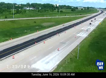 Construction cones and asphalt work in the left lanes