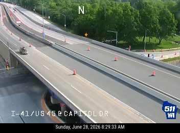 Construction cones and workers in the right lane